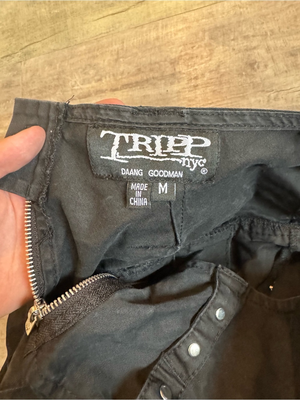Tripp NYC Pleated Mini Skirt with Ring & Strap Details - Picture 3 of 3
